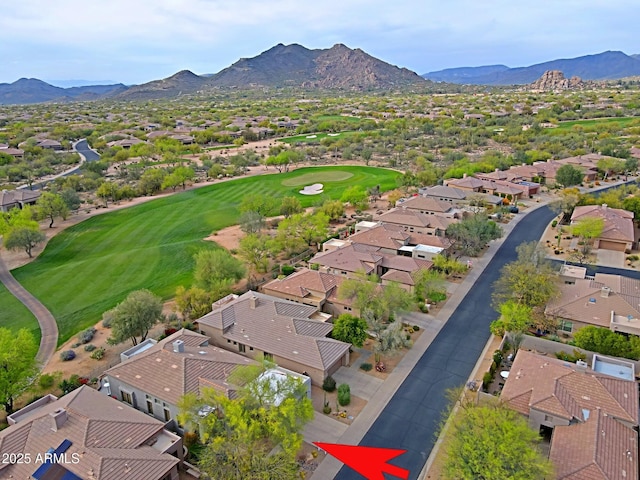 aerial view featuring view of golf course, a residential view, and a mountain view