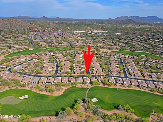 aerial view with a residential view, a mountain view, and view of golf course