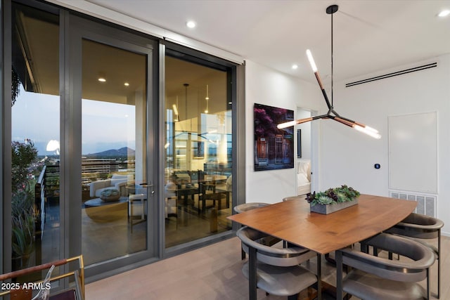 7180 E Kierland Blvd Unit 1116, Scottsdale, AZ 85254 - dining space with wood finished floors, recessed lighting, and a mountain view