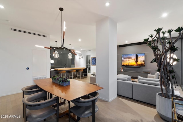 7180 E Kierland Blvd Unit 1116, Scottsdale, AZ 85254 - dining room featuring light wood-type flooring and recessed lighting