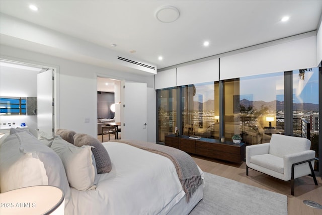 7180 E Kierland Blvd Unit 1116, Scottsdale, AZ 85254 - bedroom with light wood finished floors and recessed lighting