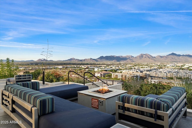 7180 E Kierland Blvd Unit 1116, Scottsdale, AZ 85254 - view of patio / terrace featuring a mountain view and an outdoor living space with a fire pit