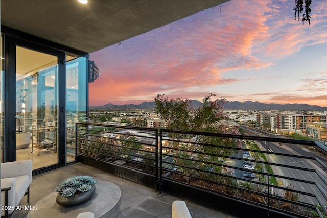 7180 E Kierland Blvd Unit 1116, Scottsdale, AZ 85254 - balcony at dusk with a mountain view and a view of city