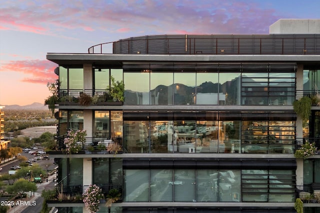 7180 E Kierland Blvd Unit 1116, Scottsdale, AZ 85254 - back of house at dusk with a balcony