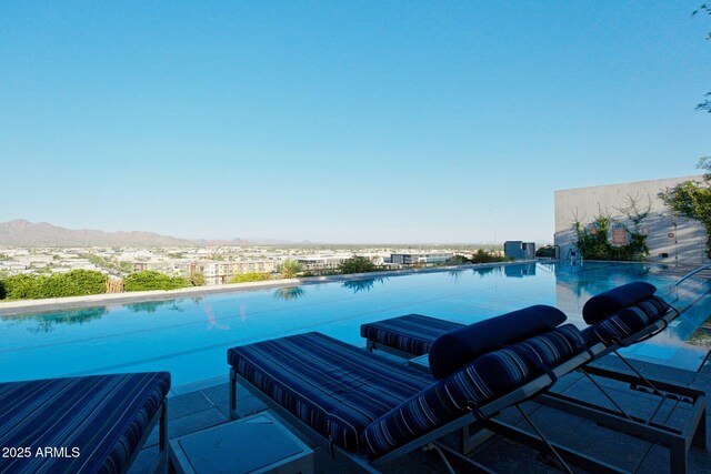 7180 E Kierland Blvd Unit 1116, Scottsdale, AZ 85254 - view of pool with a mountain view and an infinity pool