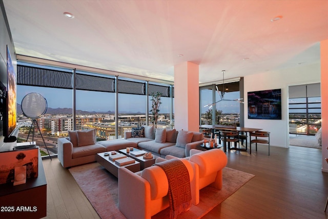 7180 E Kierland Blvd Unit 1116, Scottsdale, AZ 85254 - living room featuring a wall of windows, wood-type flooring, and a view of city