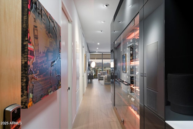 7180 E Kierland Blvd Unit 1116, Scottsdale, AZ 85254 - hallway with light wood finished floors and expansive windows