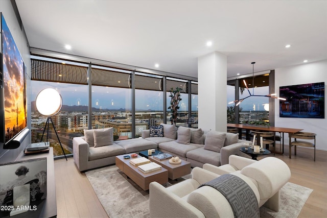 7180 E Kierland Blvd Unit 1116, Scottsdale, AZ 85254 - living area featuring light wood-type flooring, recessed lighting, and a wall of windows