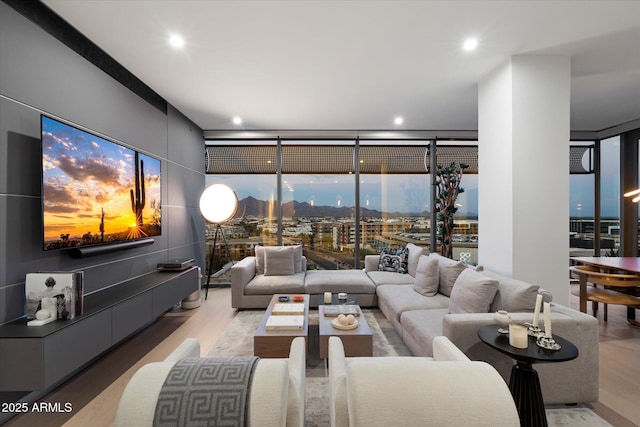 7180 E Kierland Blvd Unit 1116, Scottsdale, AZ 85254 - living area with floor to ceiling windows, light wood-style floors, and recessed lighting