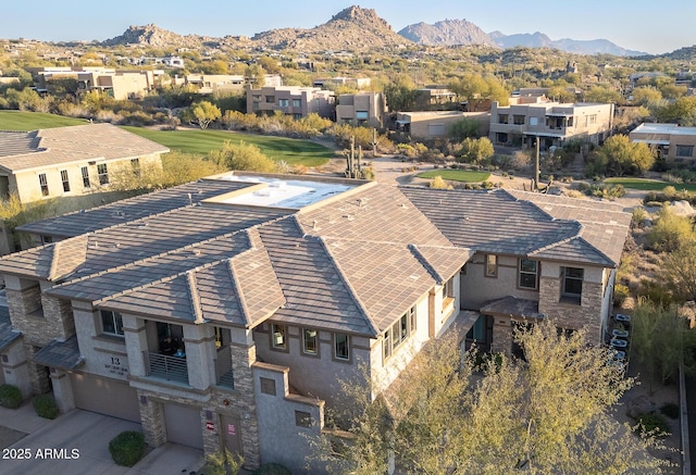 birds eye view of property featuring a mountain view