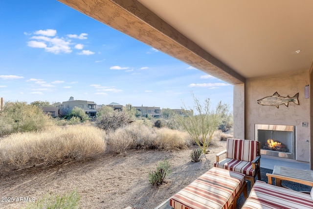 exterior space featuring an outdoor fireplace