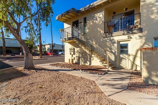 14261 N Oakwood Ln, Fountain Hills, AZ 85268 - view of side of home with stucco siding and stairs