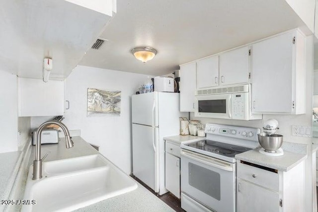 14261 N Oakwood Ln, Fountain Hills, AZ 85268 - kitchen with light countertops, a sink, white cabinetry, white appliances, and visible vents