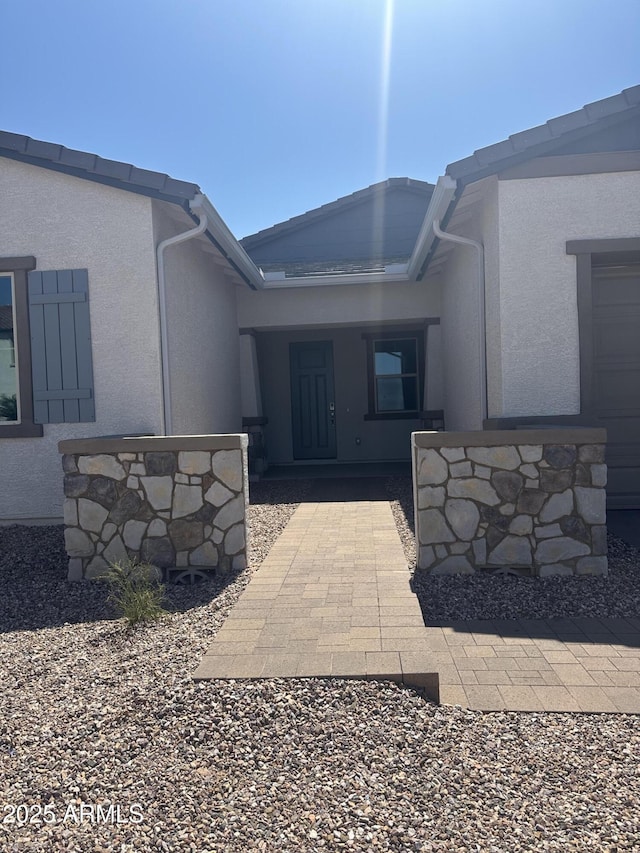 43471 N Wollemi St, Queen Creek, AZ 85140 - view of exterior entry with stucco siding
