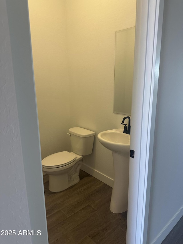43471 N Wollemi St, Queen Creek, AZ 85140 - half bathroom featuring toilet, wood finished floors, and baseboards