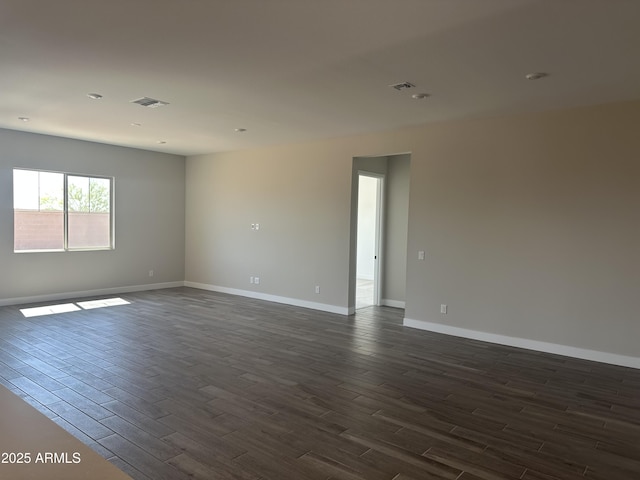 43471 N Wollemi St, Queen Creek, AZ 85140 - empty room featuring dark wood finished floors and baseboards