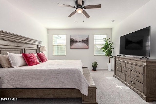 bedroom featuring ceiling fan and light carpet