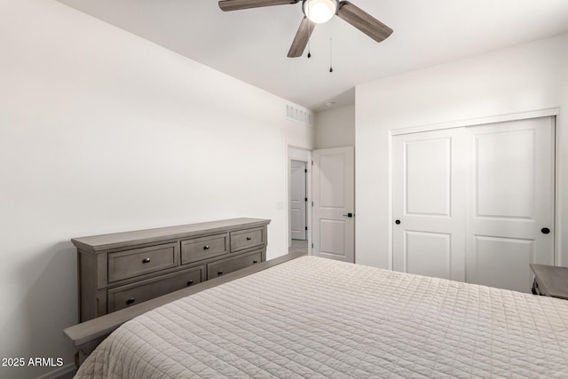 bedroom with ceiling fan and a closet