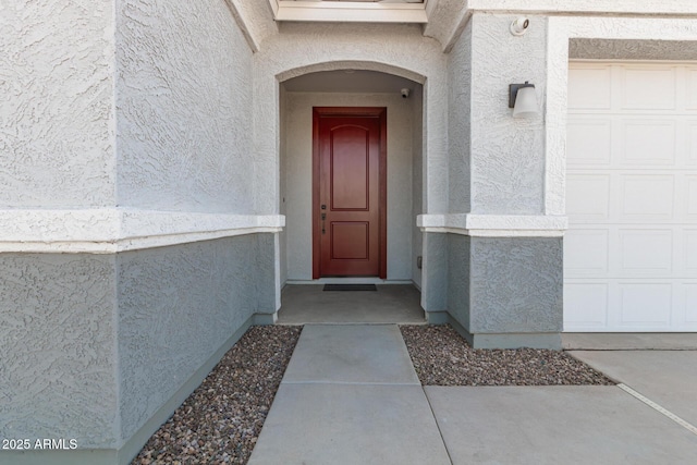 entrance to property featuring a garage