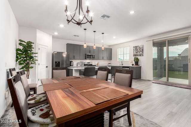 dining space featuring light wood-type flooring