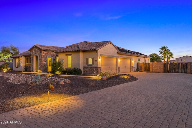 mediterranean / spanish house with a garage