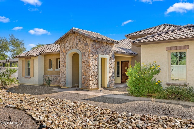 mediterranean / spanish-style house with a patio