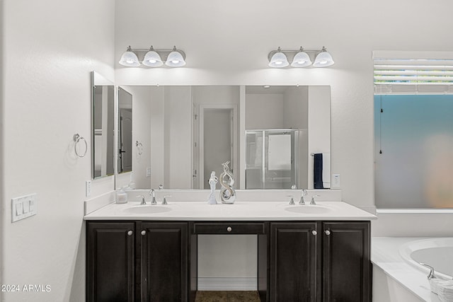 bathroom featuring vanity and separate shower and tub