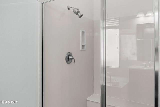 bathroom featuring an enclosed shower