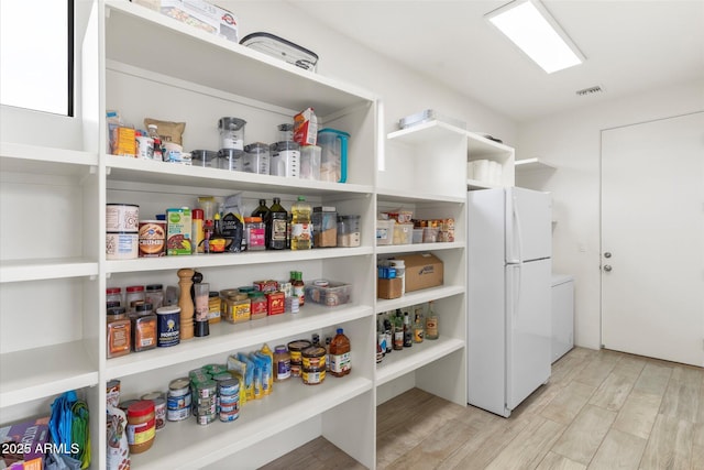 pantry featuring washer / clothes dryer