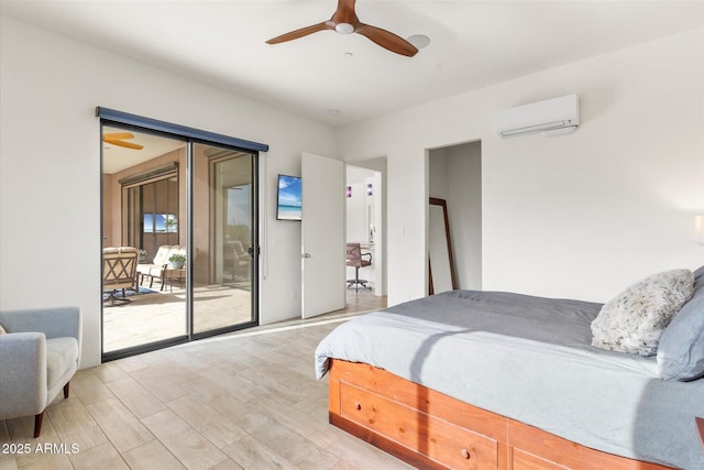 bedroom featuring an AC wall unit, access to exterior, ceiling fan, and light hardwood / wood-style flooring