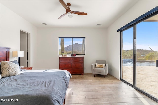 bedroom with ceiling fan, access to outside, and light wood-type flooring