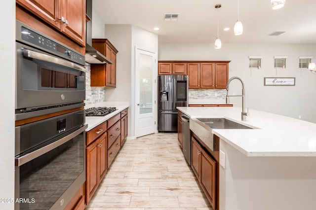 2611 S Quaintance St, Gilbert, AZ 85295 - kitchen featuring appliances with stainless steel finishes, a sink, tasteful backsplash, light countertops, and hanging light fixtures