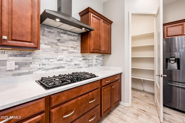2611 S Quaintance St, Gilbert, AZ 85295 - kitchen featuring stainless steel fridge with ice dispenser, wall chimney range hood, black gas cooktop, backsplash, and light stone counters