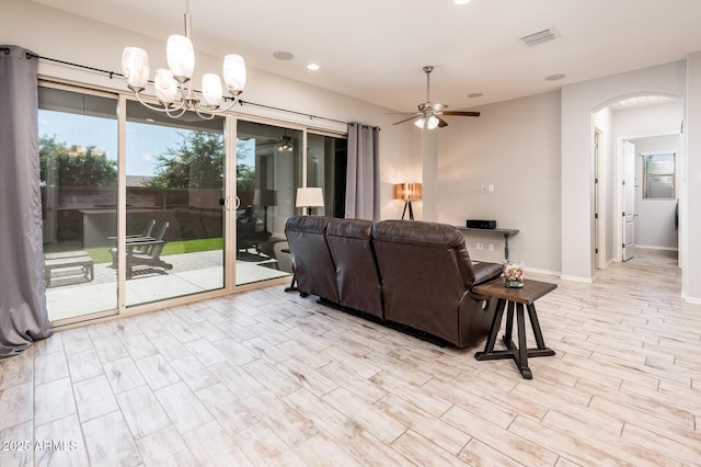 2611 S Quaintance St, Gilbert, AZ 85295 - living area featuring ceiling fan, arched walkways, recessed lighting, a chandelier, and baseboards