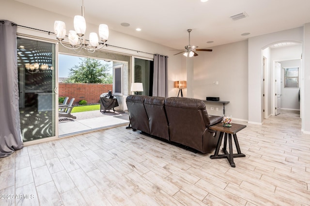 2611 S Quaintance St, Gilbert, AZ 85295 - living area featuring arched walkways, a chandelier, recessed lighting, ceiling fan, and baseboards