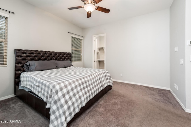 2611 S Quaintance St, Gilbert, AZ 85295 - carpeted bedroom with baseboards, a ceiling fan, and a walk in closet