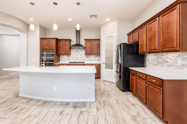 2611 S Quaintance St, Gilbert, AZ 85295 - kitchen featuring wall chimney range hood, freestanding refrigerator, tasteful backsplash, double oven, and recessed lighting