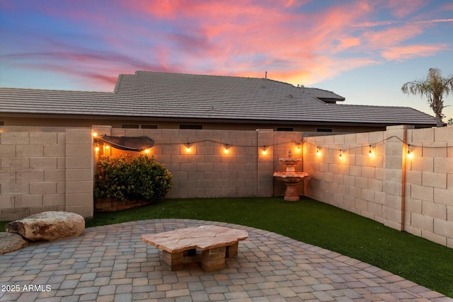 view of patio terrace at dusk