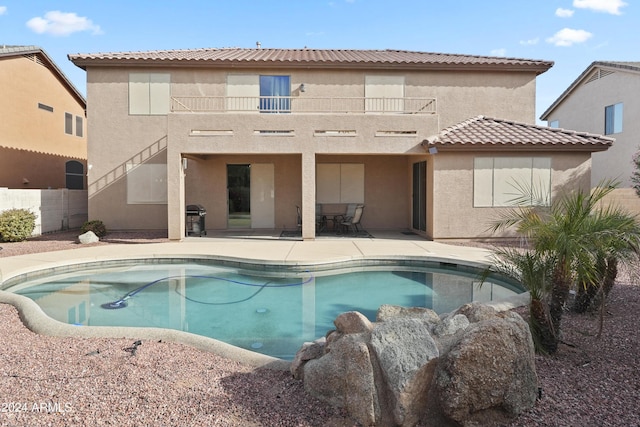 view of swimming pool with a patio and grilling area