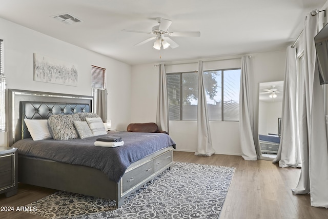 bedroom with ceiling fan and light wood-type flooring