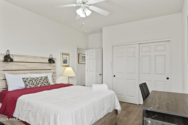 bedroom with wood-type flooring, a closet, and ceiling fan