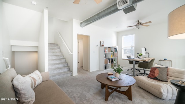 carpeted living room featuring ceiling fan