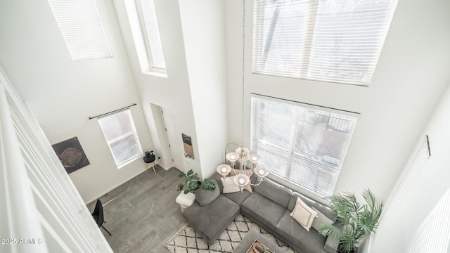 living room featuring a towering ceiling