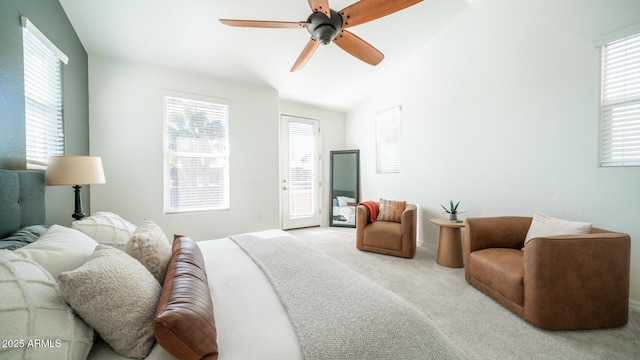 bedroom with ceiling fan, lofted ceiling, and light carpet