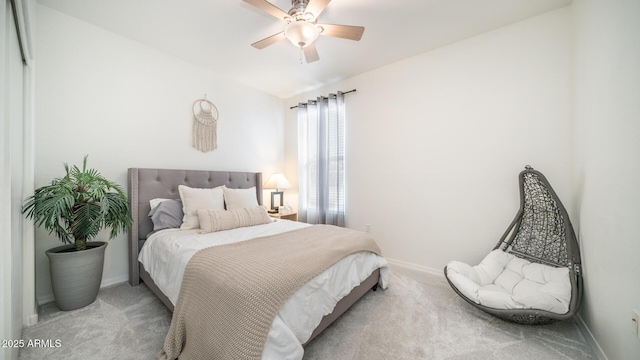 carpeted bedroom with ceiling fan and lofted ceiling