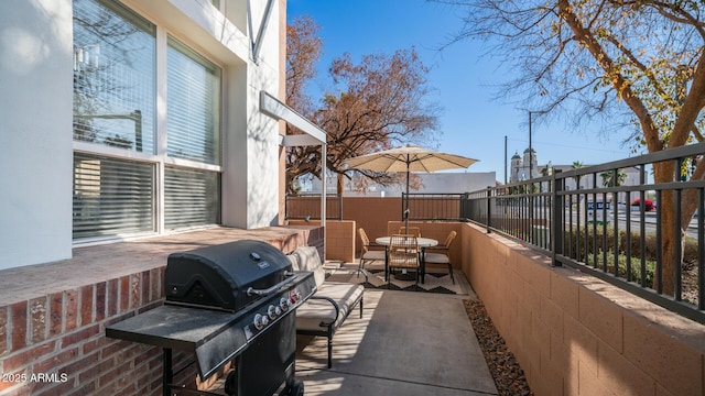 view of patio with a grill