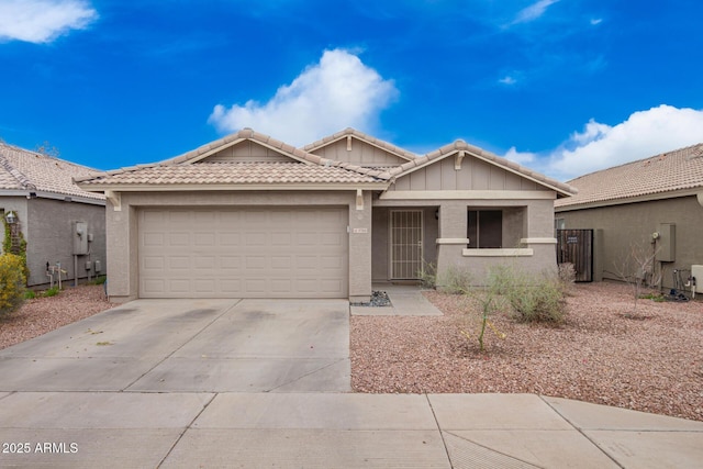 ranch-style home featuring stucco siding, an attached garage, driveway, and a tiled roof