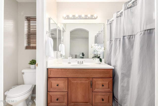 bathroom with toilet and vanity