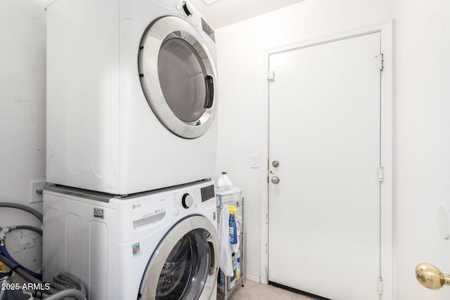 laundry area featuring laundry area and stacked washer / drying machine