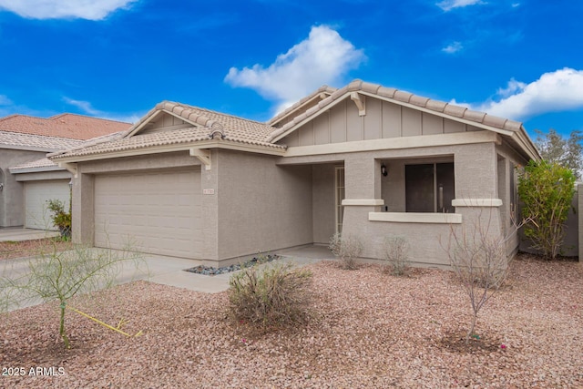 view of front facade featuring stucco siding, driveway, and an attached garage